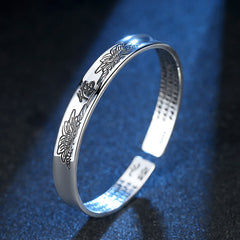 Heart Sutra Lotus Copper Cuff Bracelet - silver cuff with Buddha and lotus engravings on dark blue, Meditative elegance