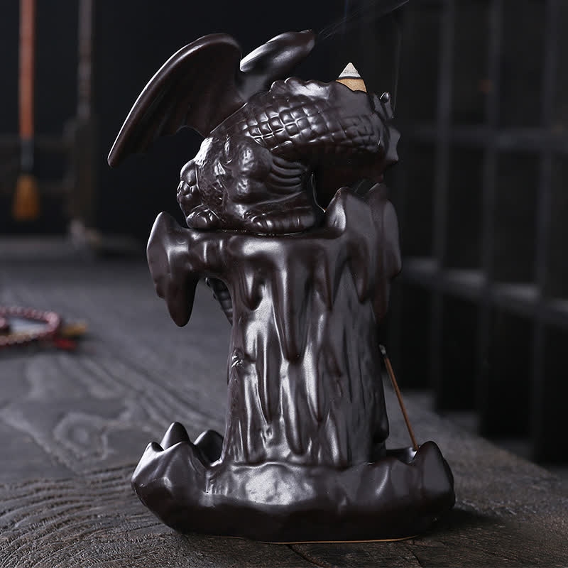 Nordic Dragon Backflow Incense Burner winged dragon on rock base, smoke cascade on dark wood, ceramic incense holder
