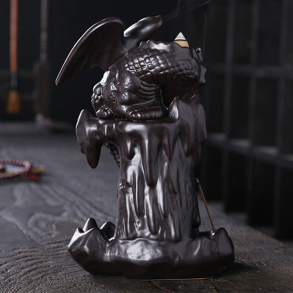 Nordic Dragon Backflow Incense Burner winged dragon on rock base, smoke cascade on dark wood, ceramic incense holder
