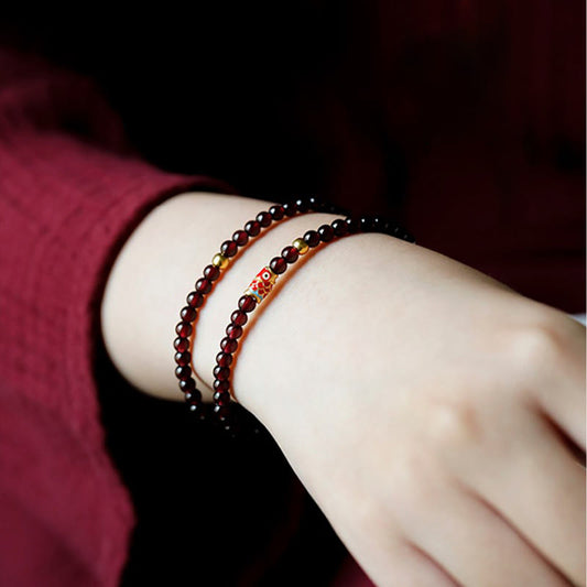 999 Gold Koi Bracelet – koi fish tail fin detail, garnet stone clarity, gold koi fish bracelet