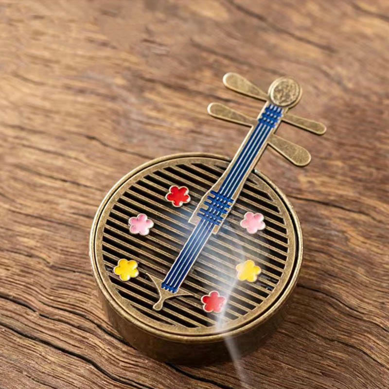 Copper Incense Burner Set – brass pipa burner with colored floral inlays, smoke on wood grain
