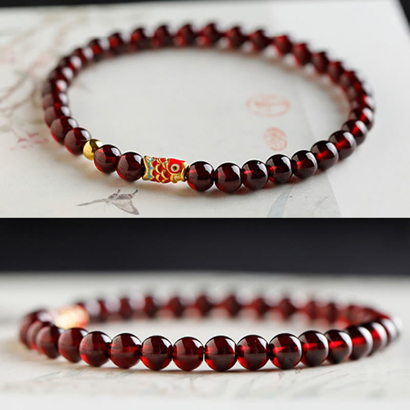 999 Gold Koi Fish Bracelet – back view showing fish scale engraving, natural garnet, gold koi bracelet