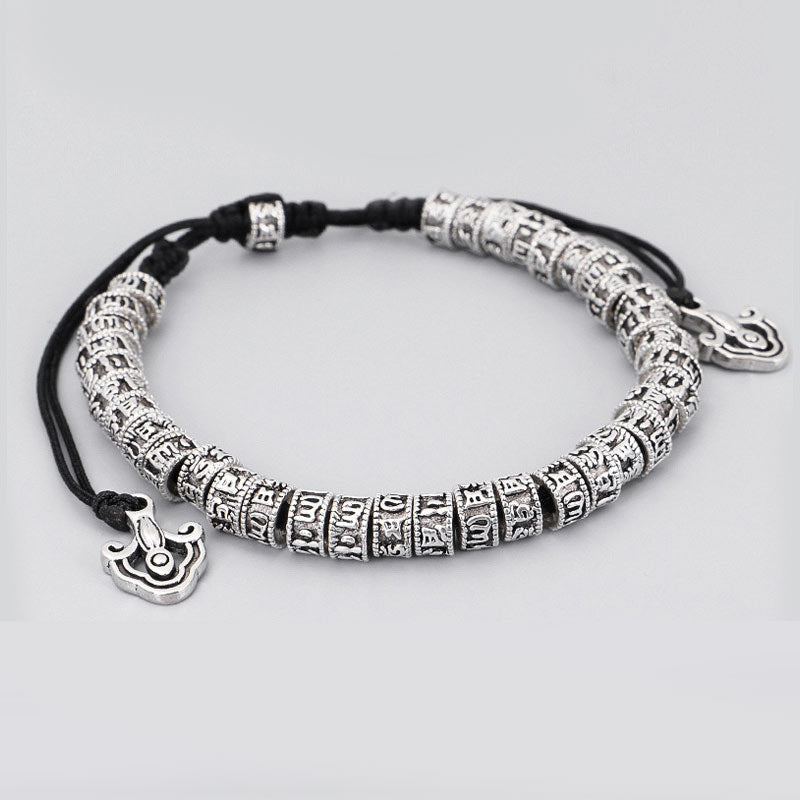 Tibetan Mantra Purity Bracelet – Antiqued silver cylindrical beads with Tibetan script on cord, mantra jewelry