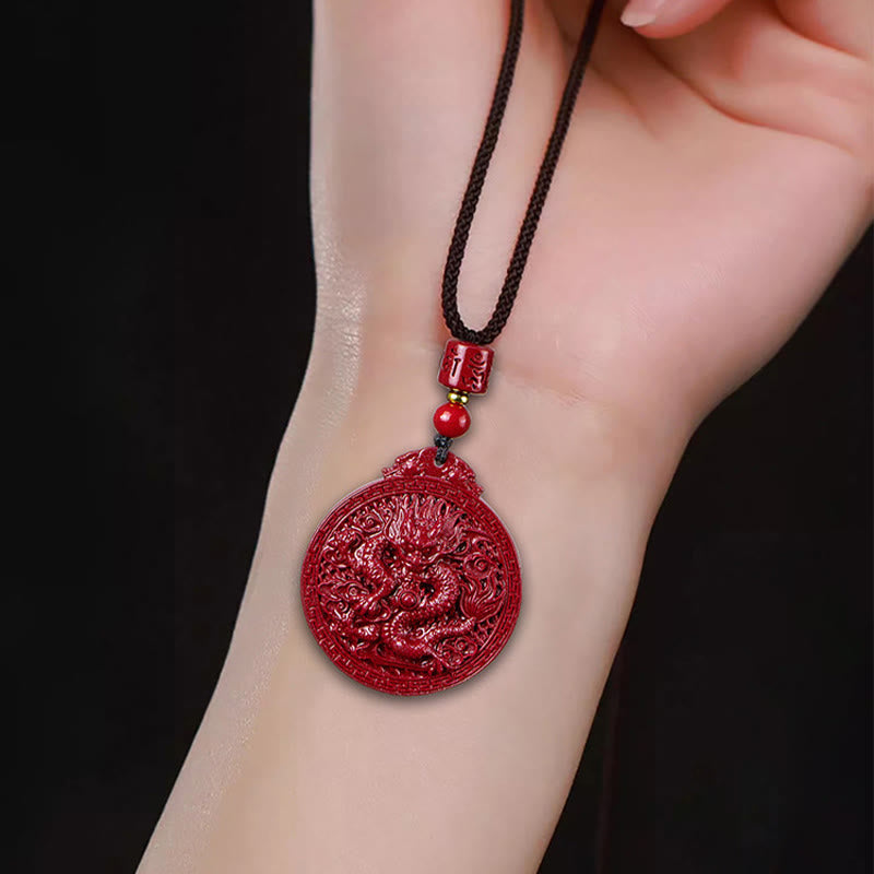 Cinnabar Dragon Pendant – Red carved dragon amulet resting on wrist with fortune bead, Meaningful