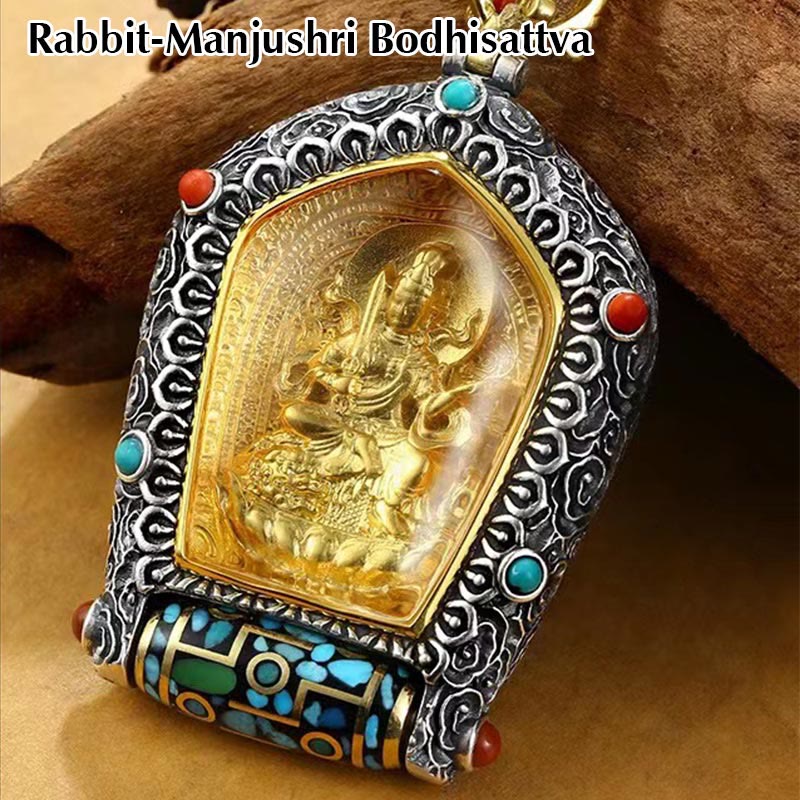 Tibetan Zodiac Buddha Dzi Bead Necklace – Gold Amitabha Buddha in silver frame with turquoise coral inlays and prayer wheel base, warm wood branch, close-up three-quarter