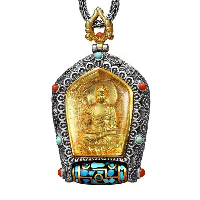 Tibetan Zodiac Buddha Dzi Bead Necklace – Gold Jambhala wealth deity pendant in oxidized silver frame with turquoise coral accents and prayer wheel base on driftwood
