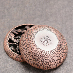 Plum Incense Burner - Round copper censer with Zen character medallion and plum blossom interior, zen incense burner