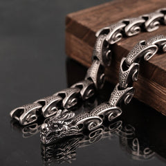 Dragon Necklace Bracelet Set - Silver dragon head bracelet on black mirror, Strength