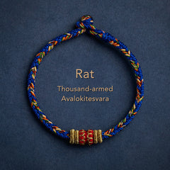 Blue braided cord bracelet for Rat zodiac with Thousand-armed Avalokitesvara blessing bead, gold and red Buddhist charm, adjustable Chinese knot jewelry