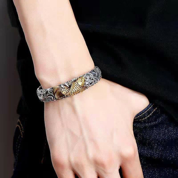 Koi Fish Grass Pattern Bangle - top-down angle revealing detailed koi fish engraving, wealth charm