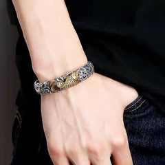 Koi Fish Grass Pattern Bangle - top-down angle revealing detailed koi fish engraving, wealth charm
