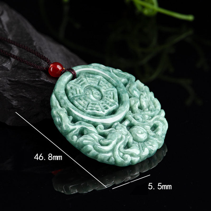 Dragon Jade Yin Yang Necklace – Intricately carved green-white jade disc with dragon phoenix Bagua design on black cord, pure white background studio shot