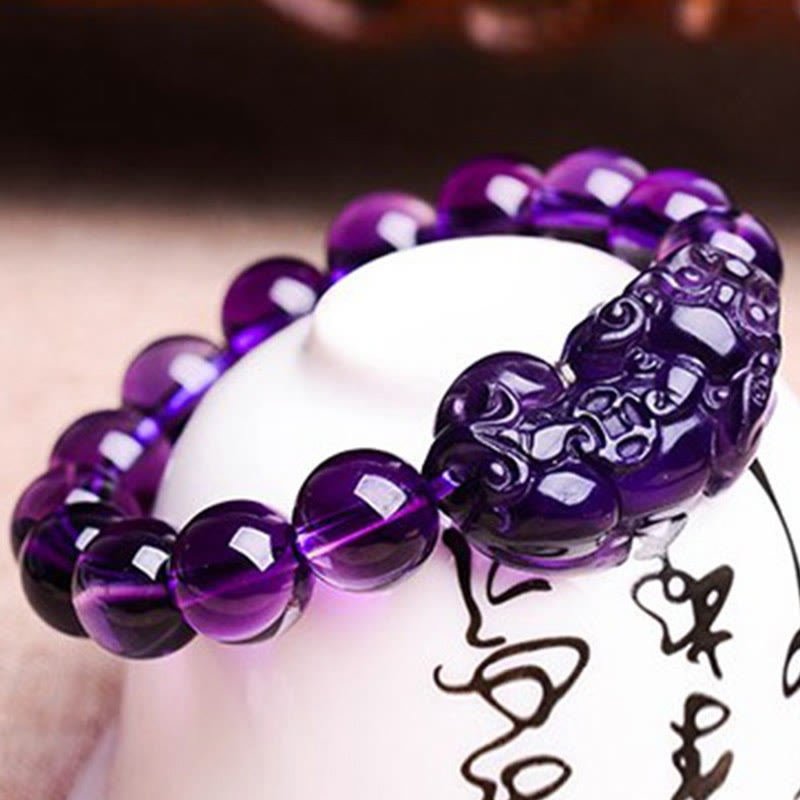 Amethyst PiXiu Fortune Bracelet – Close-up carved purple PiXiu on calligraphy ceramic, spiritual protection
