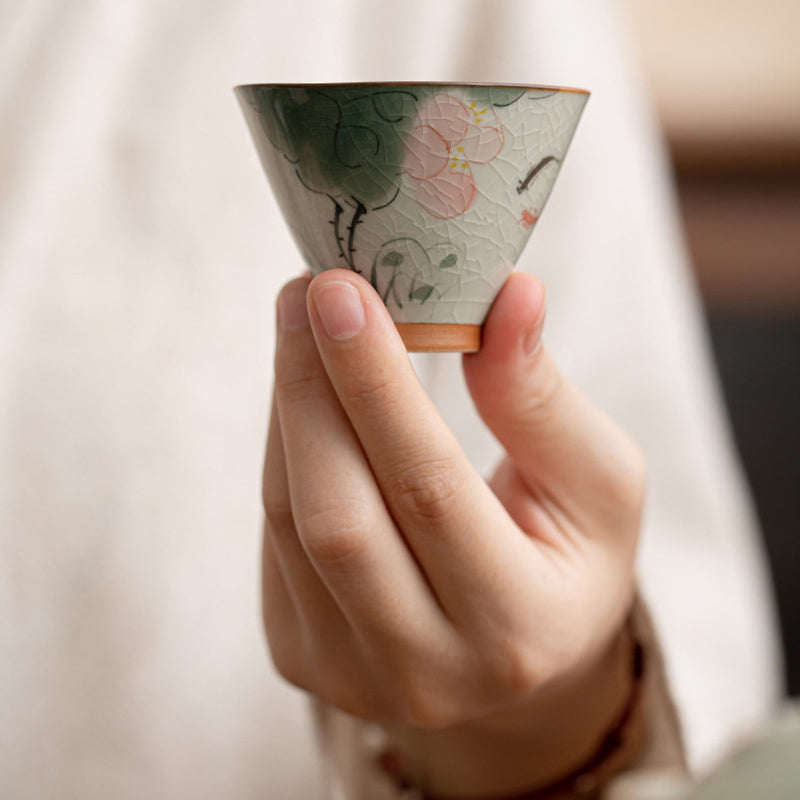 Persimmon Koi Teacup – bottom base showing kiln mark and unglazed foot, tea ware