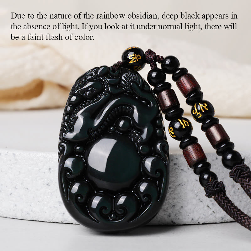 Tibetan Rainbow Obsidian PiXiu Necklace – PiXiu pendant in normal lighting showing deep black obsidian with faint color flash, feng shui