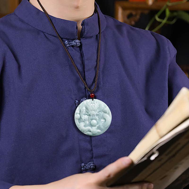 Chinese Zodiac Dragon Jade Amulet Necklace - dragon bi disc pendant styled on chest with indigo attire