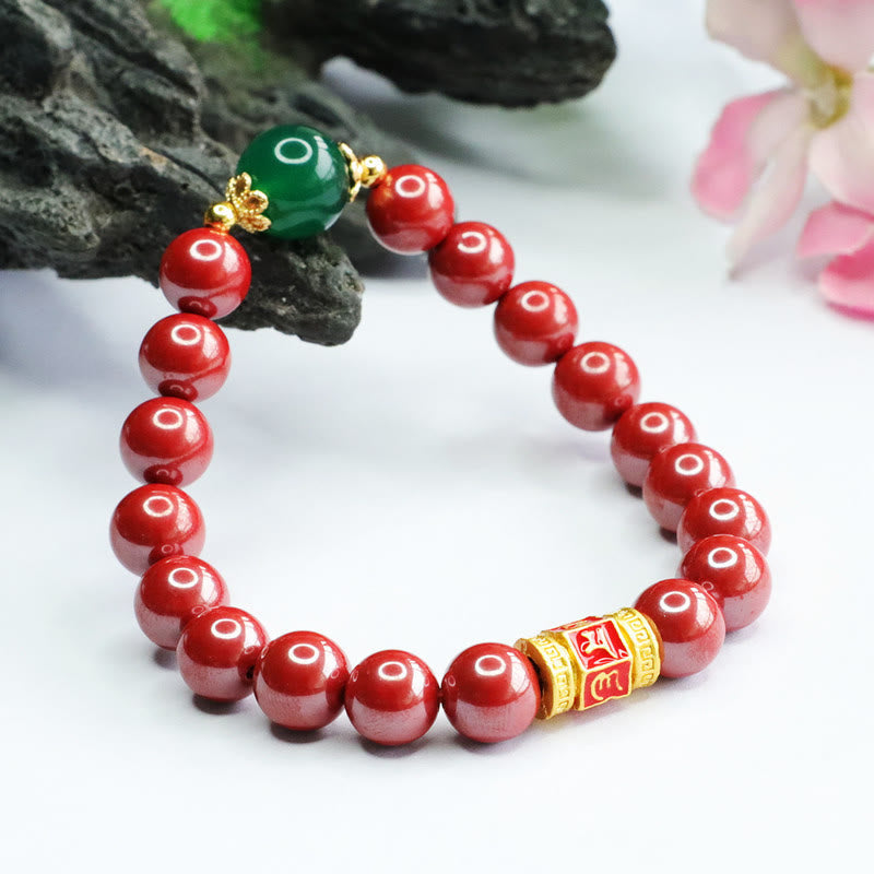 Cinnabar Agate Bracelet – With dark rock prop and flowers, gold mantra cylinder bead