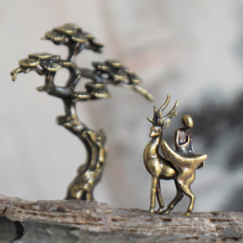 Mini Metal Meditation Buddha Decoration – monk riding deer beside brass pine tree on stone, zen garden accent