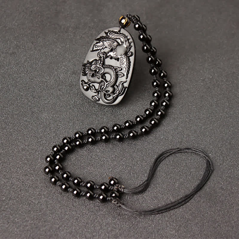 Black Obsidian Tiger Eye Dragon Phoenix Necklace – single dragon carving on obsidian with black bead chain, powerful