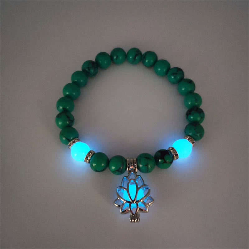 Tibetan Turquoise Glowstone Lotus Bracelet – green malachite beads with cyan glowing lotus charm overhead view, green lotus bracelet