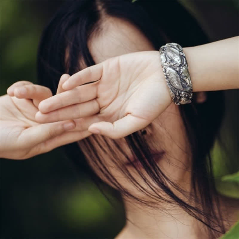 Koi Lotus Luck Bracelet – Polished copper silver finish catching light, shiny good luck bracelet