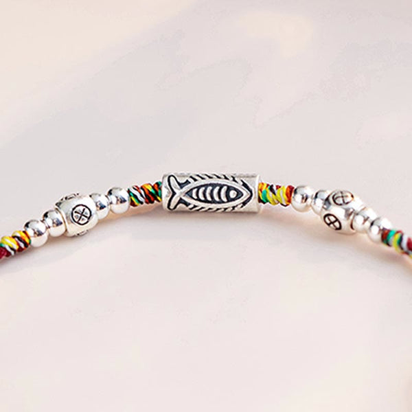 925 Koi Braided Bracelet - angled view of multi-color braided strings with koi silver pendant