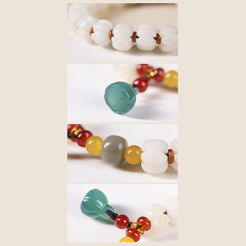Bodhi Seed Lotus Bead Bracelet - macro detail of carved lotus beads and green pendant