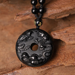 Black Obsidian Dragon Phoenix Pendant - Four celestial creatures carved bi-disc with mantra bead on knotted cord, Strength