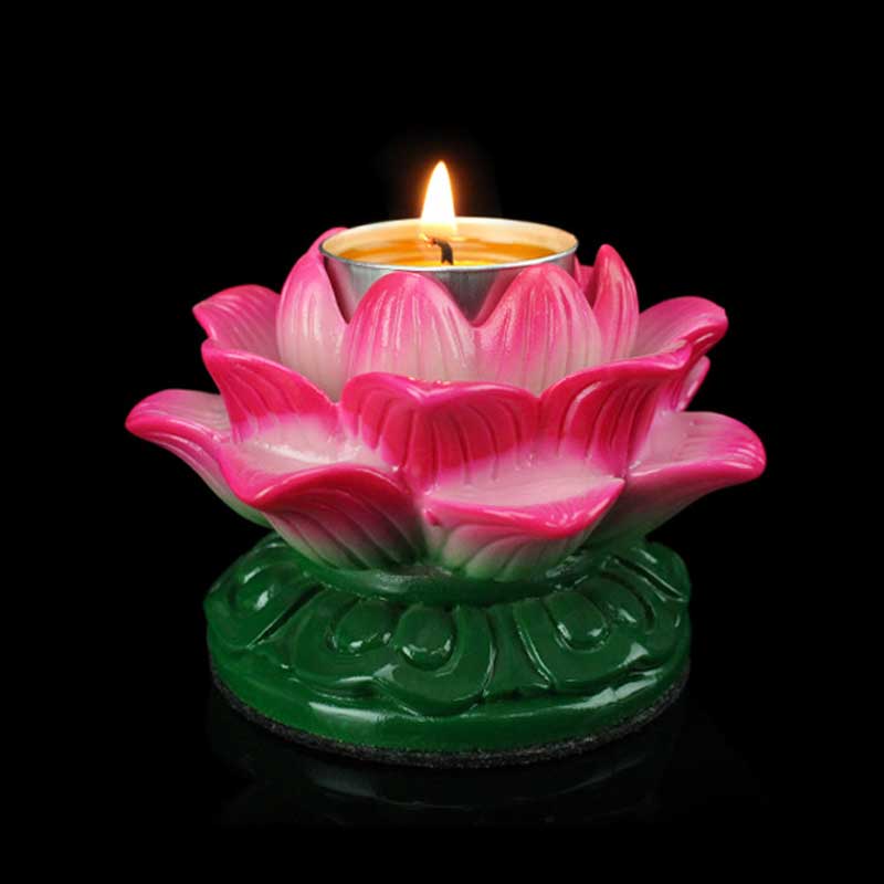 Lotus Candle Holder – Lit pink lotus with burning tealight on green leaf base, serene devotion