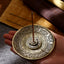 Lotus Dragon Phoenix Incense Burner – brass holder with lotus center in hand, ceremonial