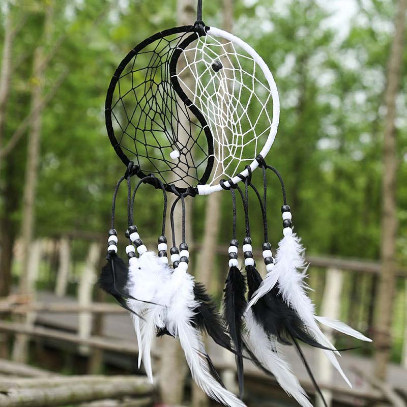 Yin Yang Dream Catcher with Feathers – Beaded dreamcatcher in garden outdoor setting, wall decor