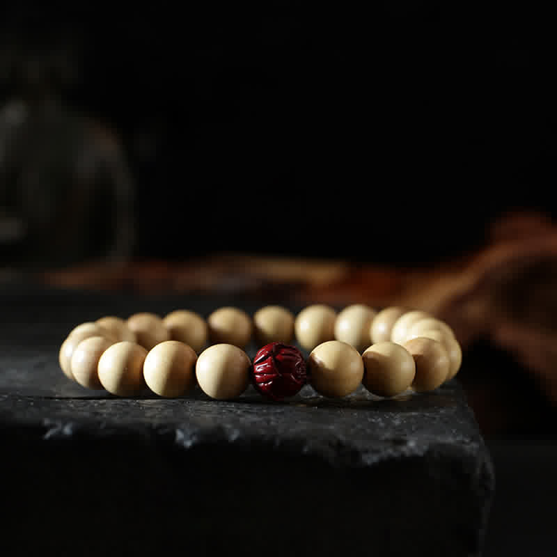 Peach Wood Yin Yang Bracelet – Cinnabar lotus accent bead on cream wooden bracelet, luck charm