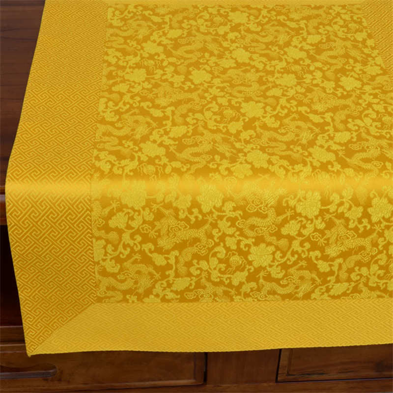 Tibetan Dragon Prayer Mat - Golden dragon brocade table runner draped on dark carved wood, tonal peony pattern, Protection