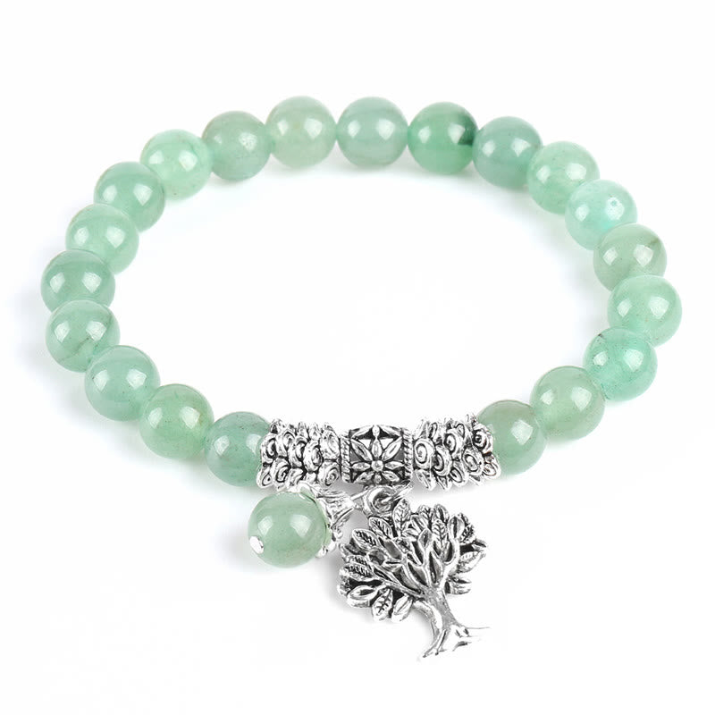 Tree of Life green aventurine bracelet with pale green gemstone beads, silver tree pendant with branches and roots, silver floral spacers.
