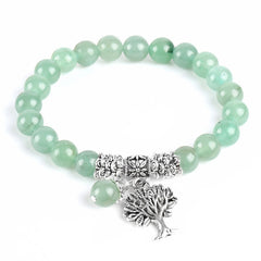 Tree of Life green aventurine bracelet with pale green gemstone beads, silver tree pendant with branches and roots, silver floral spacers.