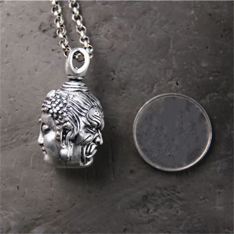 999 Silver Buddha Ghau Pendant Necklace – Natural daylight on wooden surface, zen garden decor piece