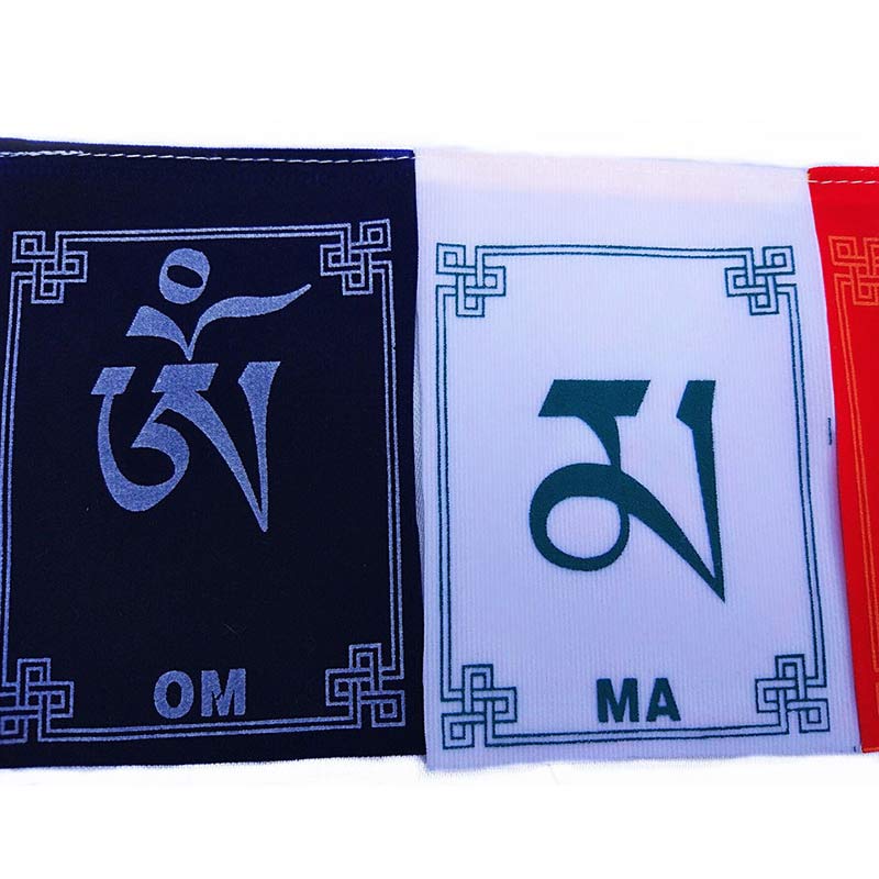 Tibetan Prayer Flags – Close-up of blue and white Om Ma flags with endless knot borders, Tibetan textile detail