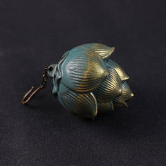 Lotus Hanging Incense Burner - Teal patina lotus bud with clasp hook, dark background, metal decor