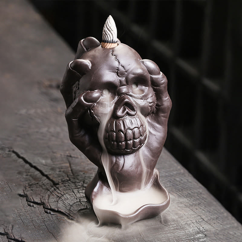 Skull Ghost Hand Burner – single hand clutching skull with cascading smoke, purple clay decor
