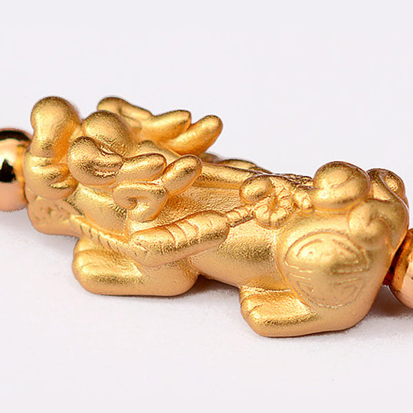 Gold-Plated PiXiu Red String Bracelet – extreme close-up gold PiXiu texture and carving detail, talisman charm