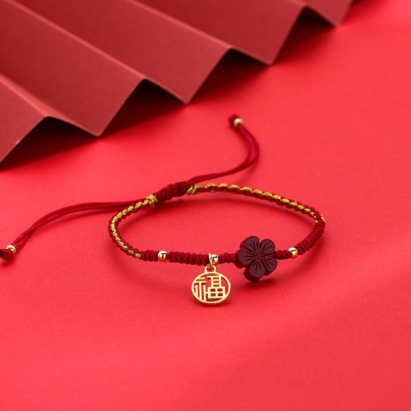 Traditional Chinese red string bracelet with gold Fu character charm and carved burgundy flower bead, adjustable braided cord lucky jewelry for women