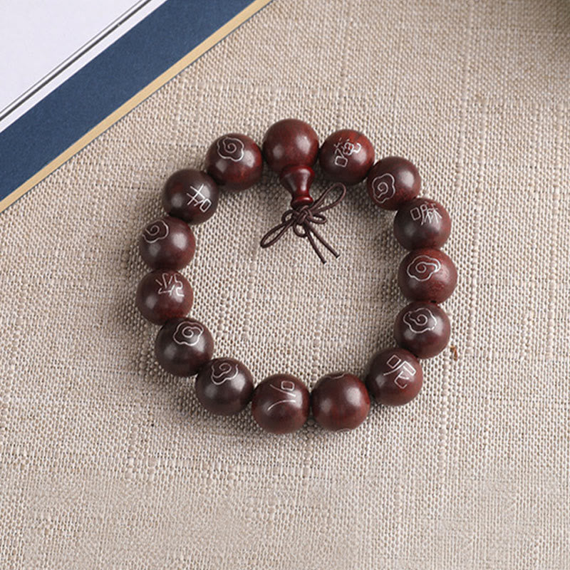 Sterling Silver Sandalwood Mantra Bracelet – flat lay overhead with guru bead and knot closure, prayer beads