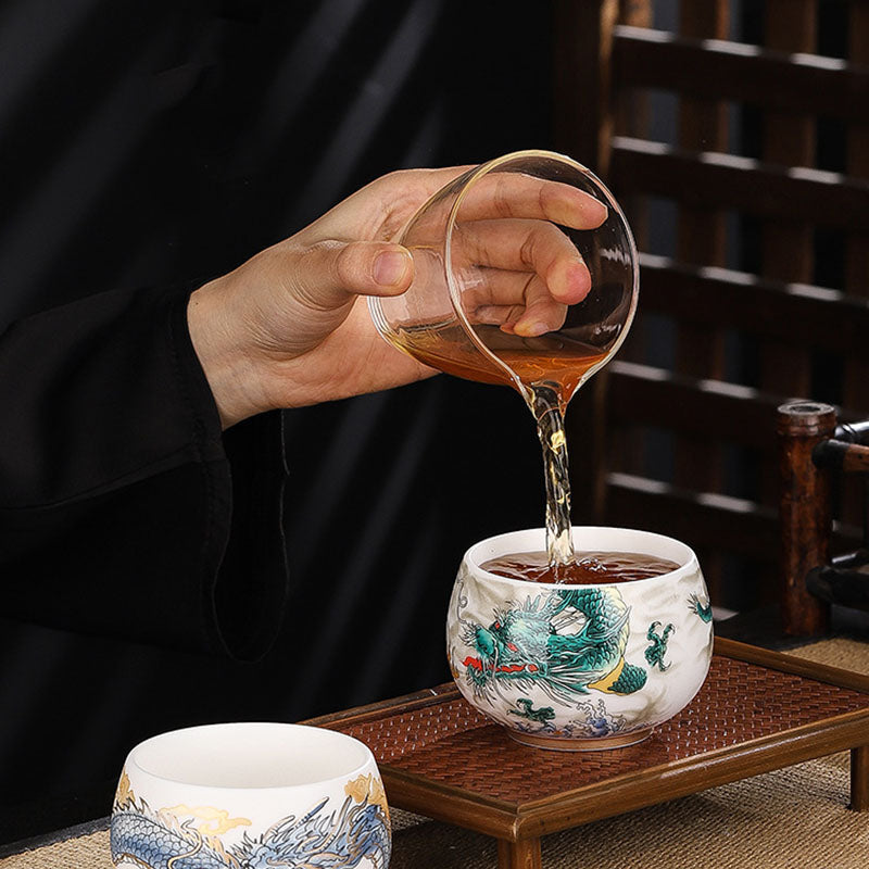 Dragon Cicada Ceramic Tea Bowl - tea pouring into green dragon cup, blue dragon bowl on bamboo tray, gongfu ceremony