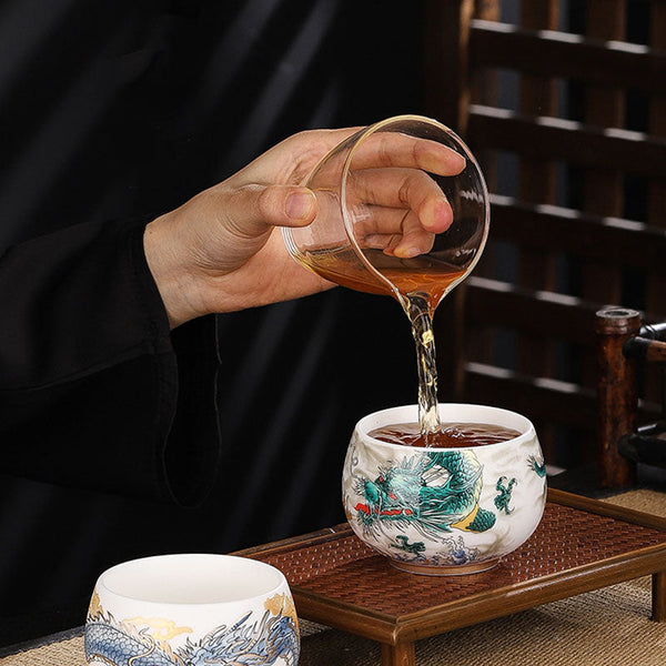 Dragon Cicada Ceramic Tea Bowl - tea pouring into green dragon cup, blue dragon bowl on bamboo tray, gongfu ceremony