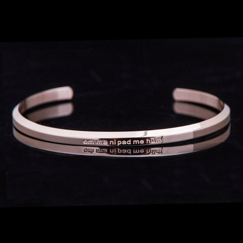 Om Mani Padme Hum Engraved Bracelet – rose gold double-band cuff with mantra text, titanium bracelet