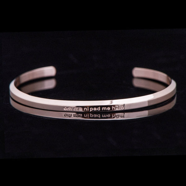 Om Mani Padme Hum Engraved Bracelet – rose gold double-band cuff with mantra text, titanium bracelet