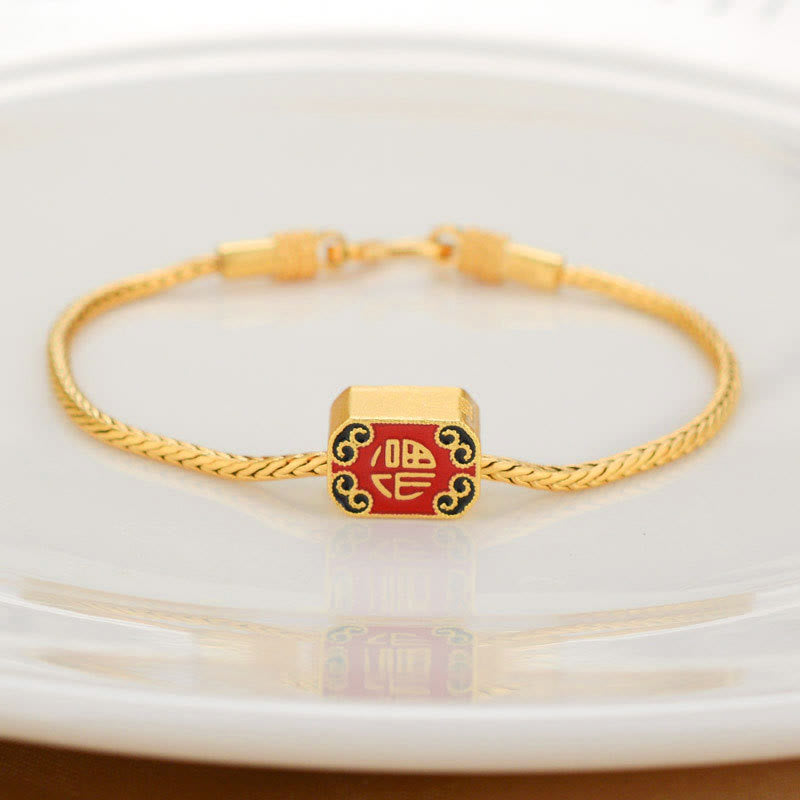 18K Gold Om Mani Padme Hum Koi Fish Bracelet – square gold bead with red Fu character and black cloud enamel, braided chain, white dish