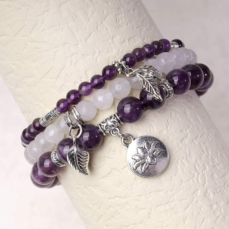 Crystal Lotus Bracelet – amethyst and white jade on wrist display with silver lotus pendant, stacking bracelet