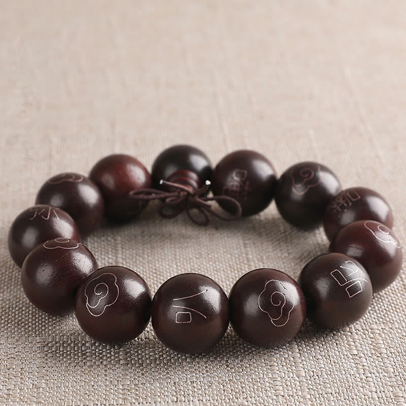 Sterling Silver Sandalwood Mantra Bracelet – three-quarter view of large beads with silver wire inlay, wooden mala