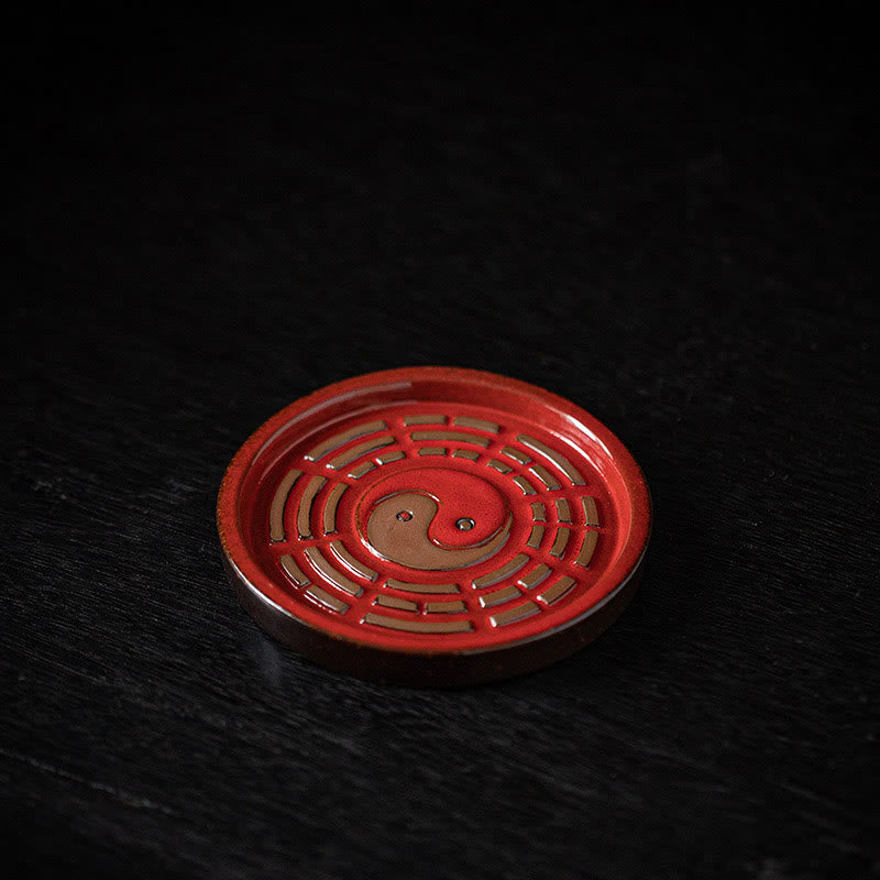 Red Bagua Ceramic Plate – Vermilion dish with bronze yin-yang and eight trigram cutouts, incense base